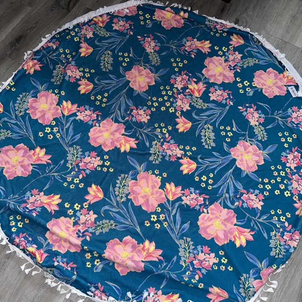 Adore Me round beach towel with tassels. 60” in diameter.